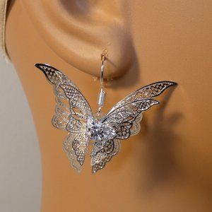 Large butterfly filigree style earrings, silver metal